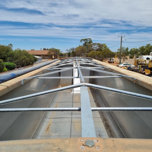 Image showing new welded fabricated tarp bars for truck trailer from the top view.