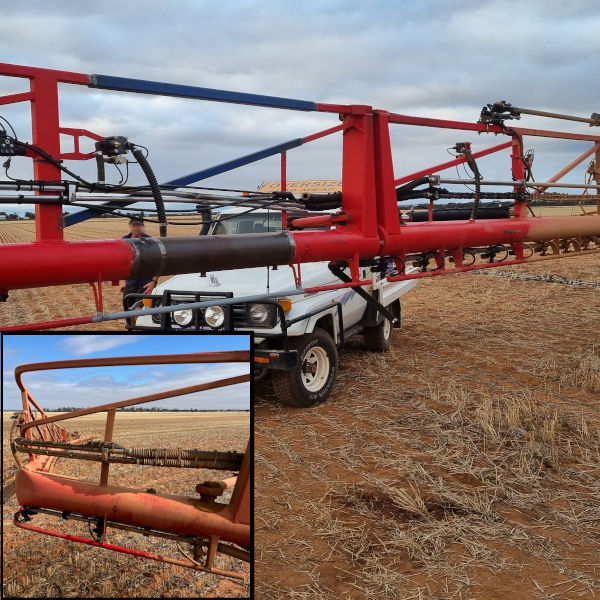 Image showing Gup repairing an air seeder bar severely bent on a farm in Bonnie Rock Wyalki, Central Wheatbelt of Western Australia