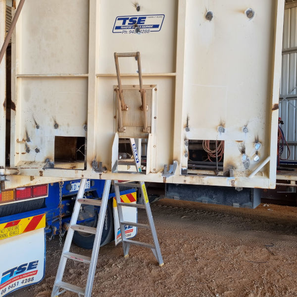Welder boilermaker installing grain doors in tipper truck Koorda